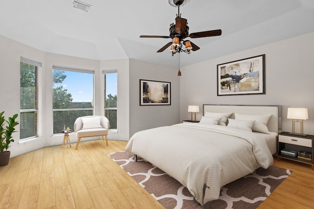 bedroom with ceiling fan and light wood-type flooring