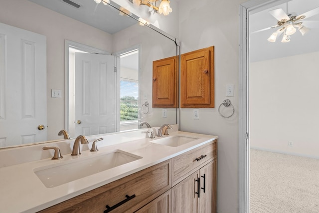 bathroom featuring ceiling fan and vanity