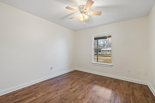 spare room featuring hardwood / wood-style floors and ceiling fan