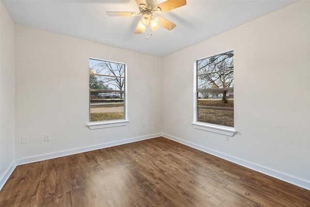 spare room featuring ceiling fan and wood-type flooring