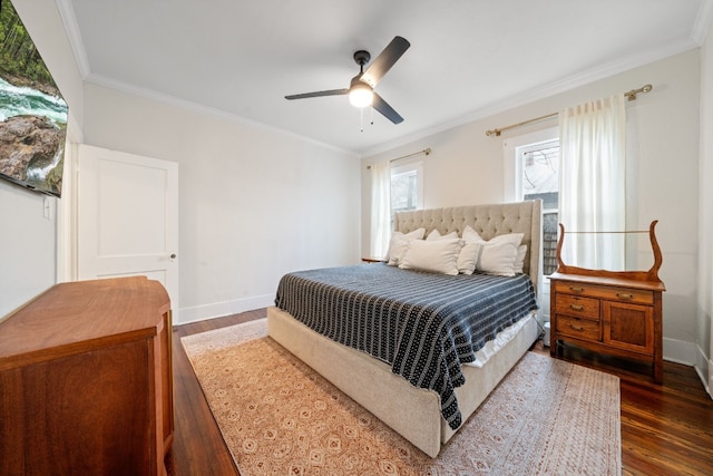 bedroom featuring dark hardwood / wood-style flooring, crown molding, and ceiling fan