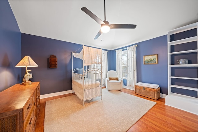 sitting room featuring ceiling fan, lofted ceiling, and light hardwood / wood-style flooring