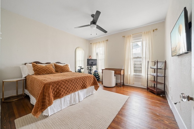 bedroom featuring hardwood / wood-style flooring and ceiling fan