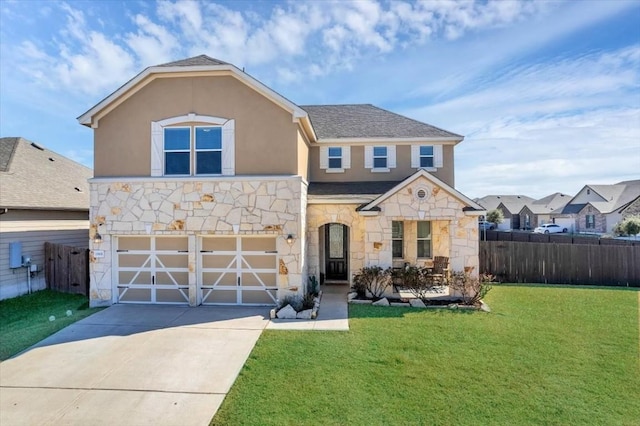 view of front of property with a garage and a front yard