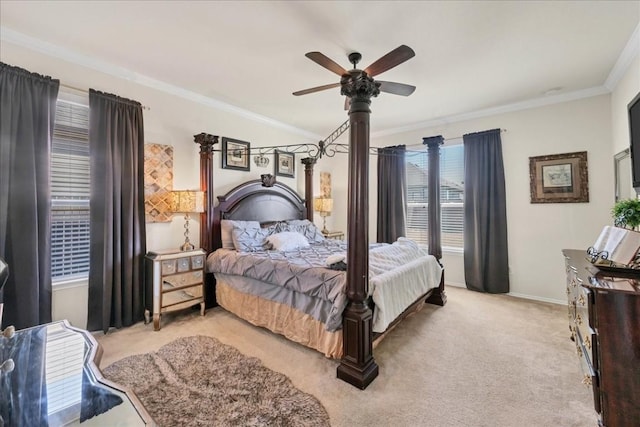 bedroom featuring crown molding, light colored carpet, and ceiling fan