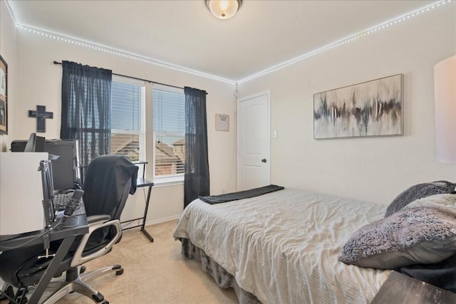 bedroom with light carpet and ornamental molding