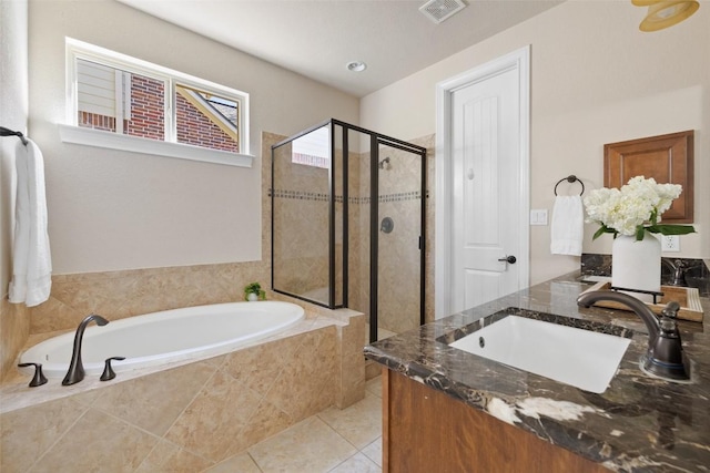 bathroom featuring vanity, tile patterned floors, and independent shower and bath