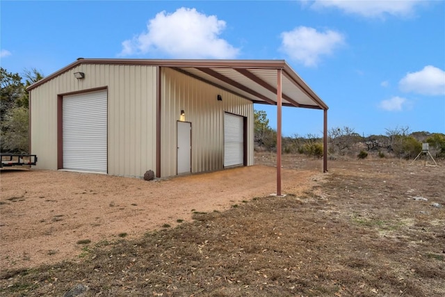 view of outbuilding with a garage