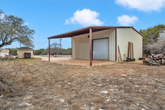 view of outbuilding with a garage