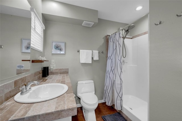 bathroom with walk in shower, vanity, toilet, and wood-type flooring