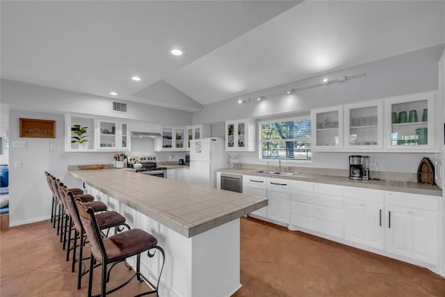 kitchen featuring dishwashing machine, sink, white cabinetry, white refrigerator, and stainless steel electric range oven