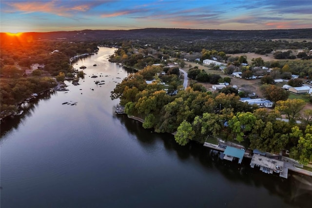 aerial view at dusk with a water view