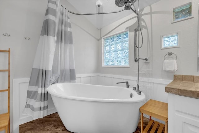 bathroom with a tub to relax in