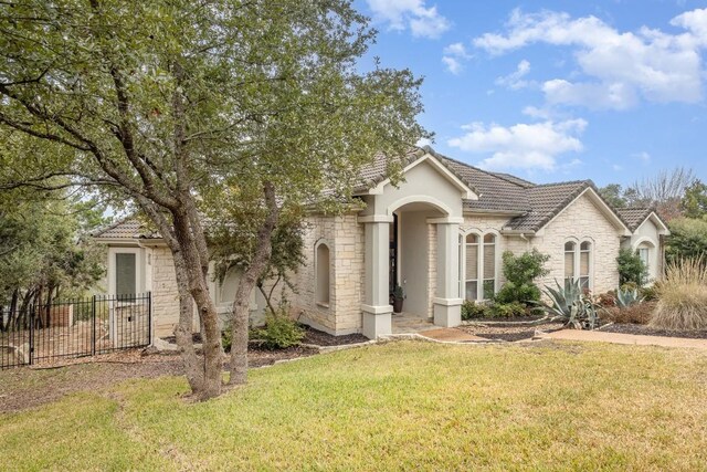 5019 Mcintyre Cir, Austin, TX 78734 - view of front facade featuring stone siding, a tiled roof, and stucco siding