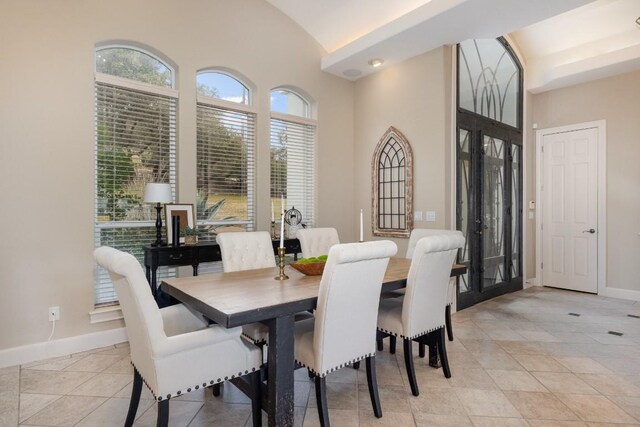 5019 Mcintyre Cir, Austin, TX 78734 - dining space with french doors, lofted ceiling, and light tile patterned flooring