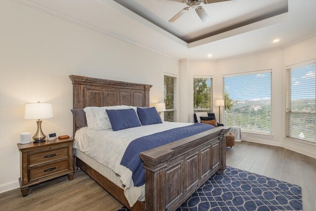 5019 Mcintyre Cir, Austin, TX 78734 - bedroom featuring multiple windows, wood finished floors, ceiling fan, recessed lighting, and ornamental molding