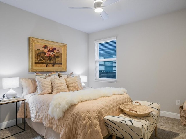 carpeted bedroom featuring a ceiling fan and baseboards