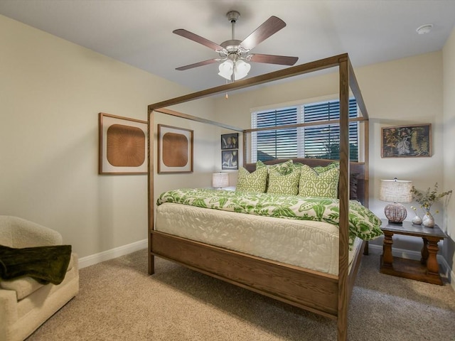 bedroom featuring ceiling fan, carpet flooring, and baseboards