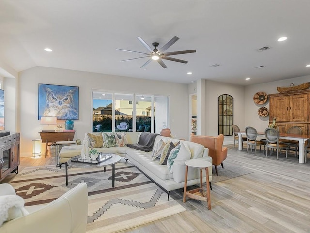 living room with visible vents, ceiling fan, light wood-style flooring, and recessed lighting