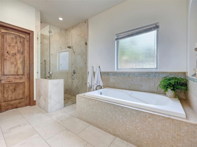 bathroom featuring plus walk in shower and tile patterned flooring