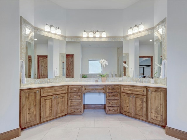 bathroom featuring tile patterned flooring and vanity