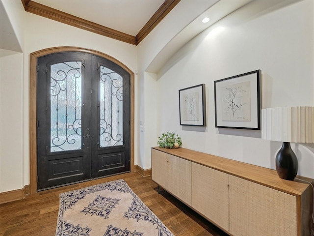 entryway featuring ornamental molding, dark hardwood / wood-style floors, and french doors