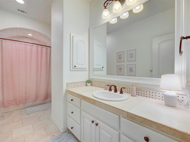 bathroom with vanity and a shower with shower curtain