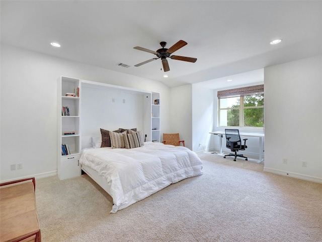 bedroom featuring ceiling fan and carpet