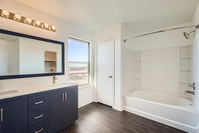 bathroom with vanity, wood-type flooring, and bathing tub / shower combination