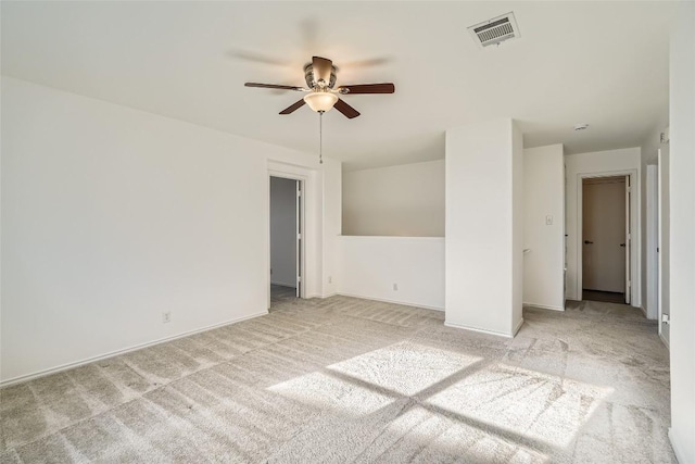 empty room featuring light carpet and ceiling fan