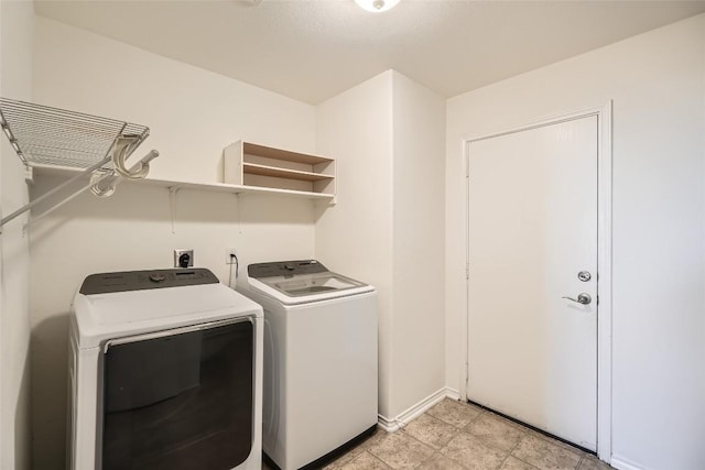 laundry room featuring washer and clothes dryer