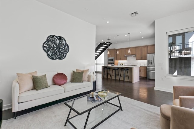 living room with dark hardwood / wood-style flooring