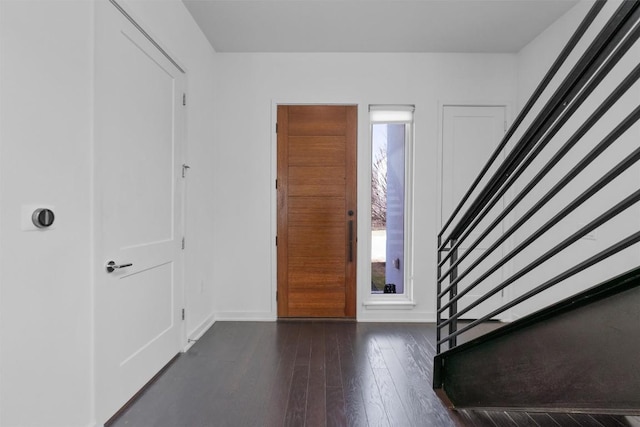 foyer entrance with dark hardwood / wood-style floors