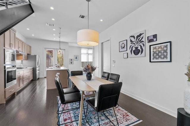 dining space featuring dark wood-type flooring and french doors