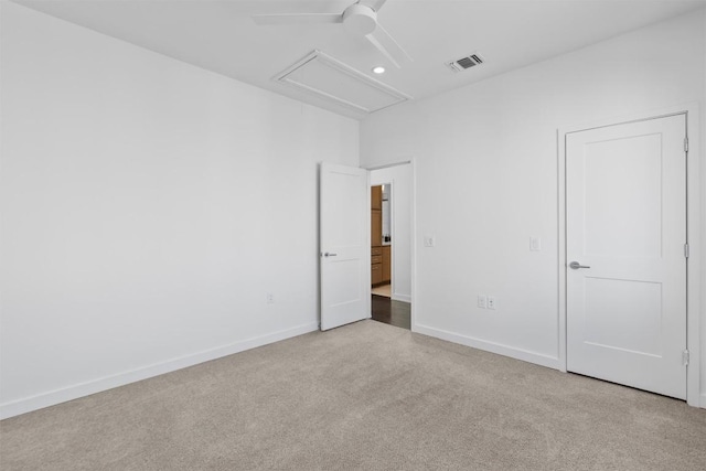 empty room featuring light carpet and ceiling fan