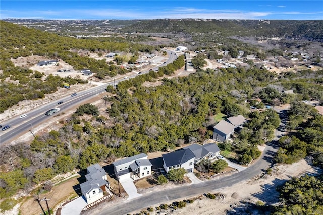 bird's eye view with a forest view and a residential view