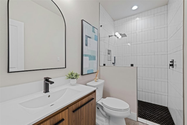 bathroom with toilet, recessed lighting, walk in shower, and vanity