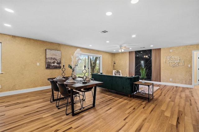 dining space featuring light hardwood / wood-style floors and ceiling fan