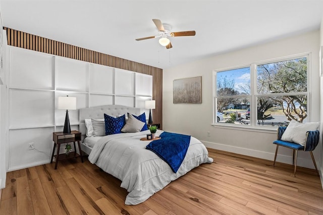 bedroom featuring ceiling fan and light hardwood / wood-style flooring