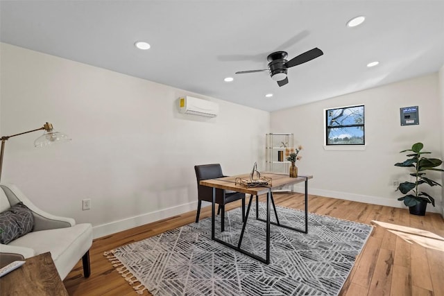 office area with ceiling fan, a wall mounted air conditioner, vaulted ceiling, and wood-type flooring