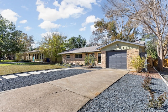 ranch-style house featuring a garage and a front lawn