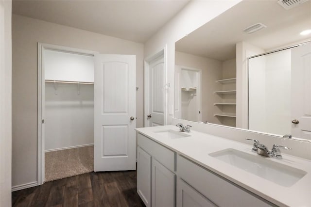 bathroom featuring vanity and hardwood / wood-style floors