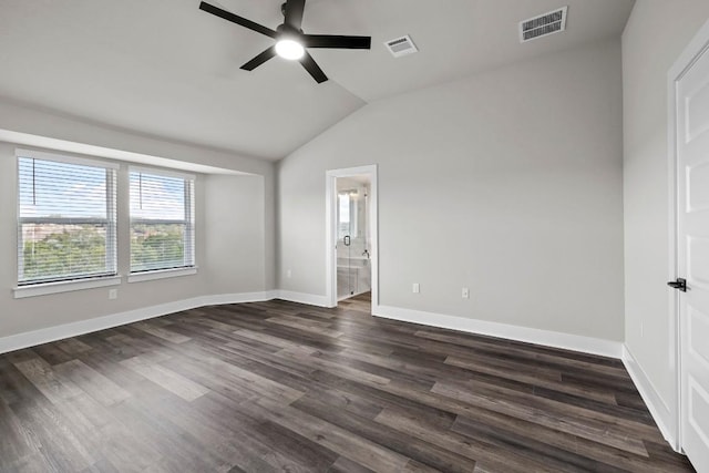 unfurnished bedroom with ceiling fan, lofted ceiling, dark hardwood / wood-style floors, and ensuite bath