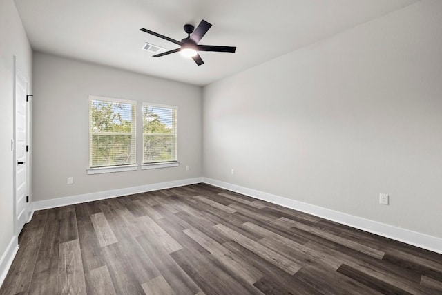 spare room featuring wood-type flooring and ceiling fan