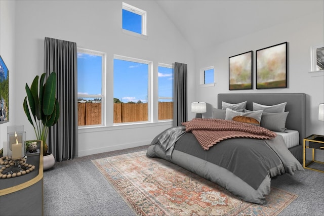 bedroom with carpet and high vaulted ceiling