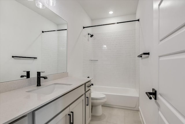 full bathroom with vanity, tile patterned floors, toilet, and tiled shower / bath