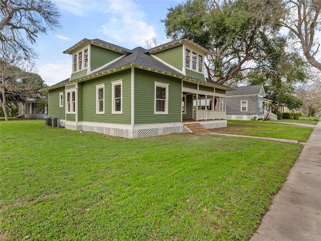 view of side of home with a porch, a lawn, and central air condition unit