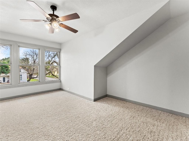 bonus room featuring vaulted ceiling, ceiling fan, and carpet flooring