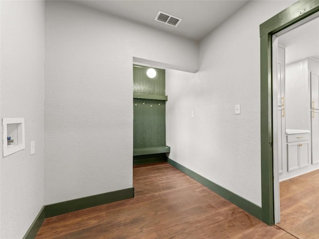 hallway featuring hardwood / wood-style flooring