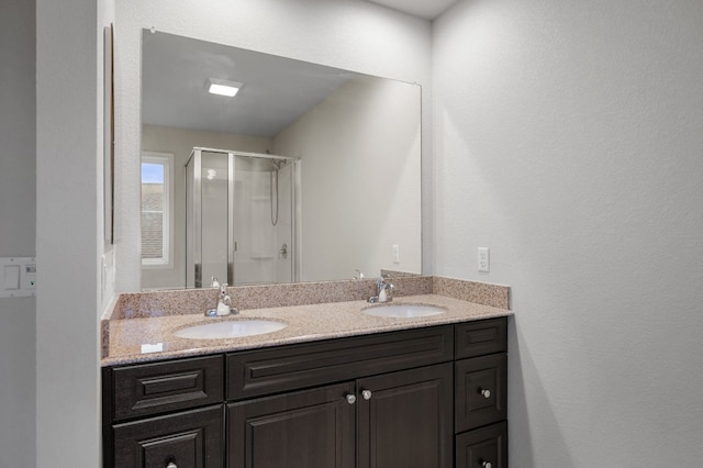 bathroom with vanity and an enclosed shower